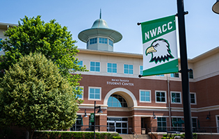 NWACC Student Center with light pole banner