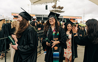 Female Student in a Graduation Cap and Gown